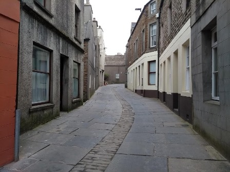 a narrow street in Stromness