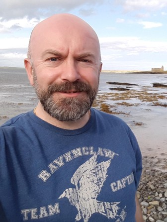 Robert Leslie profile shot on the beach