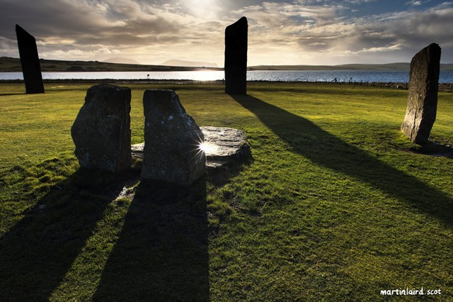 The stone of stenness by Martin Laid . Three upright stones and two smaller ones