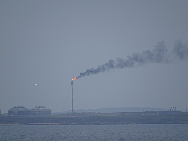 the large chimney in Flotta at the terminal issuing smoke