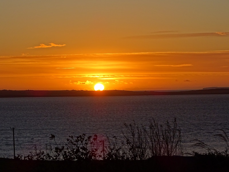 sun rising over the fileds