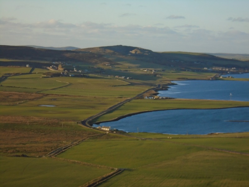 the view from Wideford Cairn across the low lying landscape