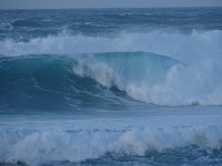 large waves crashing onto the shore are the Bay of Skaill Orkney