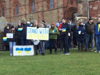 a group of people with placards in support of Ukraine