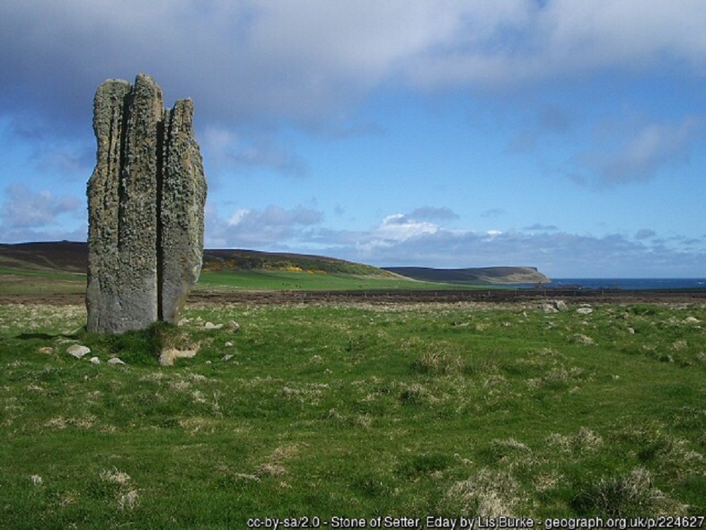The standing stone, Stone of Setter in Eday set within the treeless landscape of the island