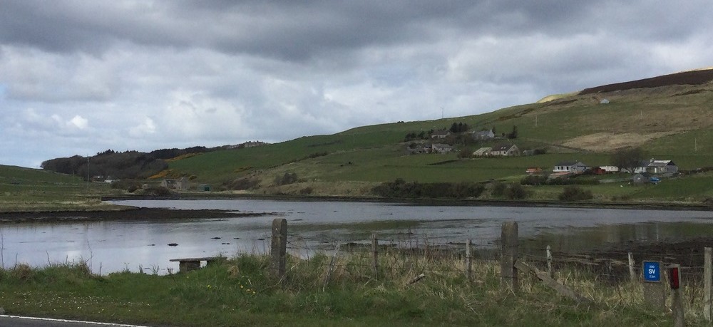 A view across The Ouse when the tide is out with the low hills in the background