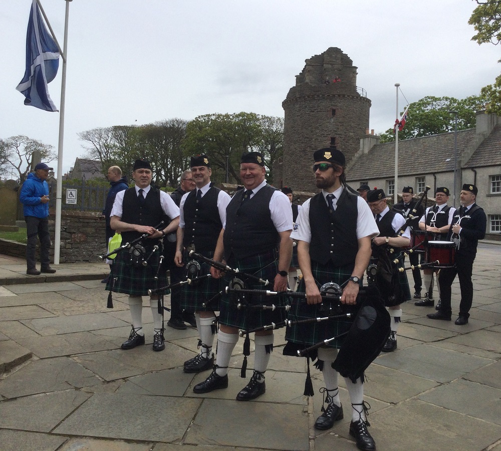 Four pipers standing at ease of Kirkwall City Pipe Band after leading the Tog at Norwegian Constitution Day