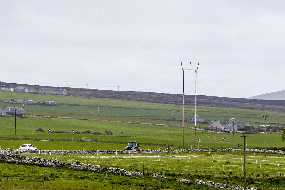 The trident pole replica in the landscape towering over everything