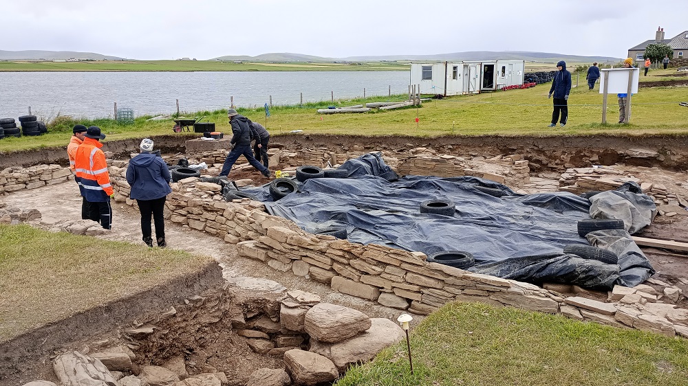 Trench J showing archaeologists at work and the remains of the great wall