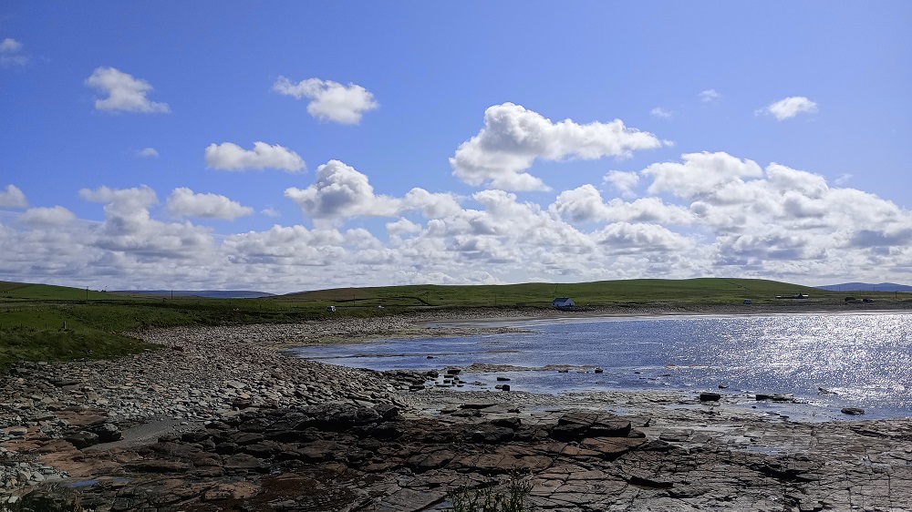 the bay at Skaill with low tide and the flat bed rock exposed