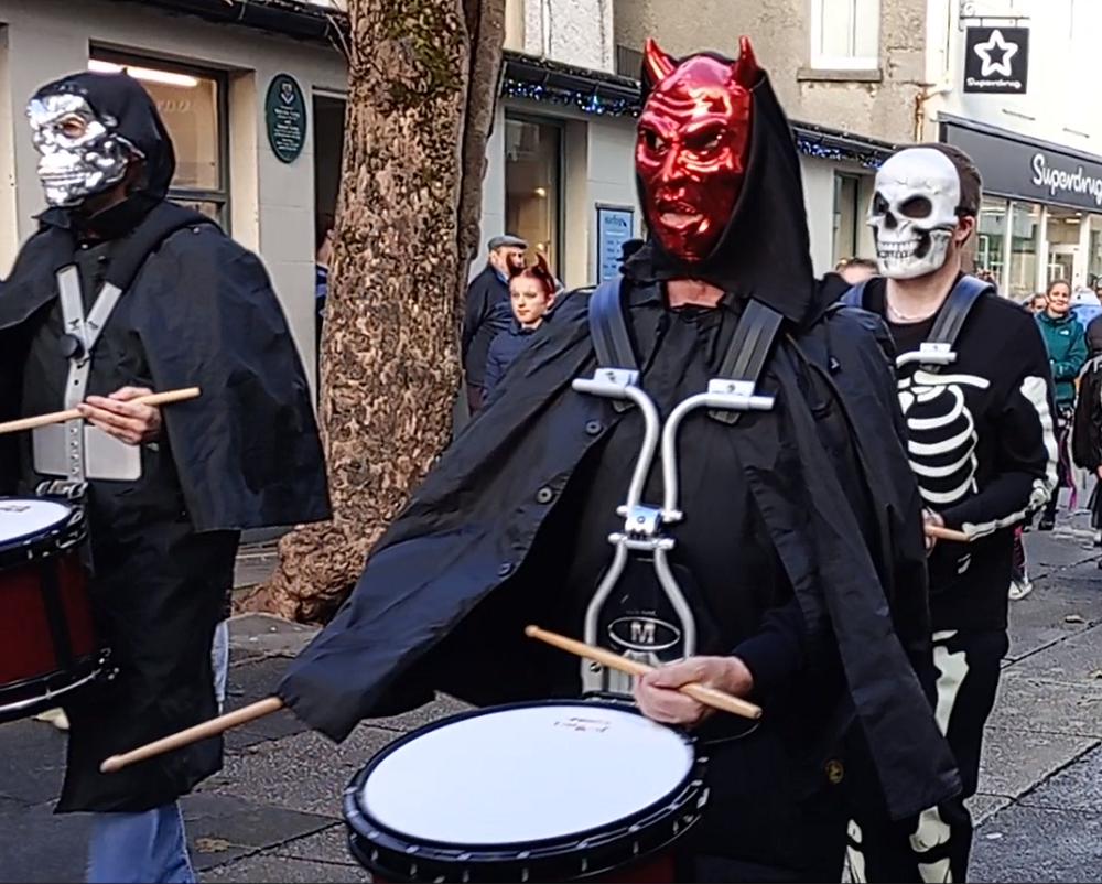 l City Pipe Band members in Halloween costumes