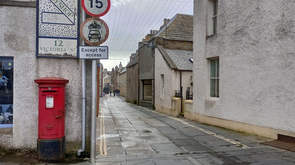 A Royal Mail pillar Box at the start of Victoria Street in Kirkwall