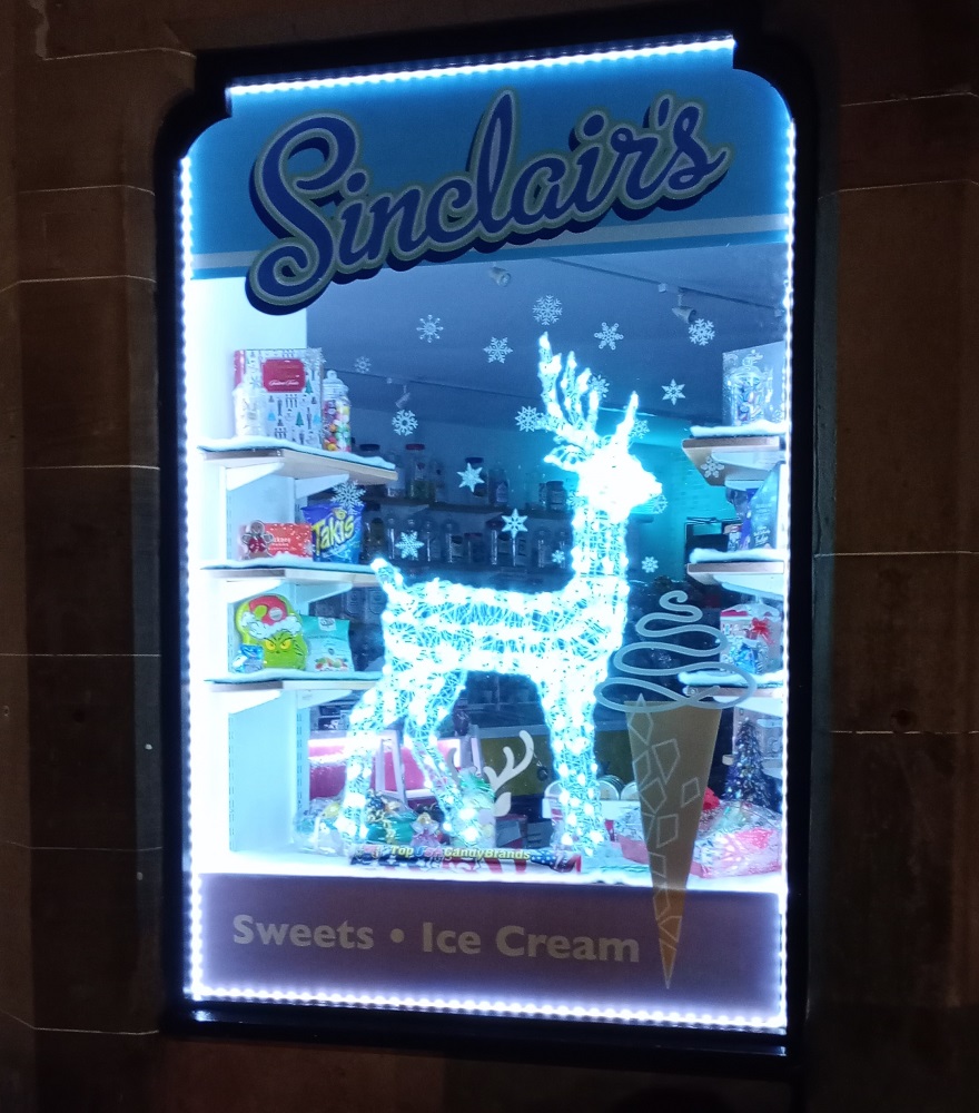 Sinclairs sweet shop with Christmas lit up reindeer in the window