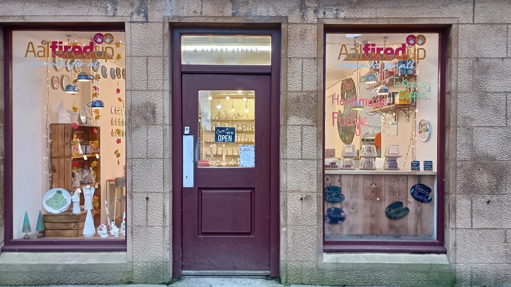 All Fired Up shop window in Kirkwall