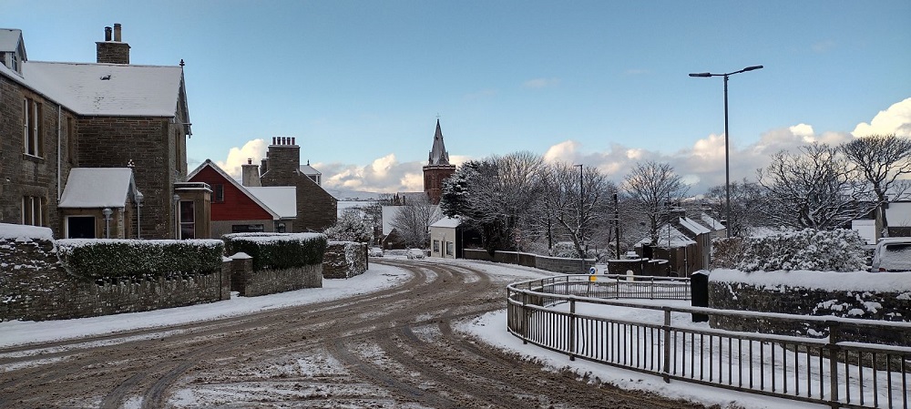 Palace road with no traffic and lots of snow