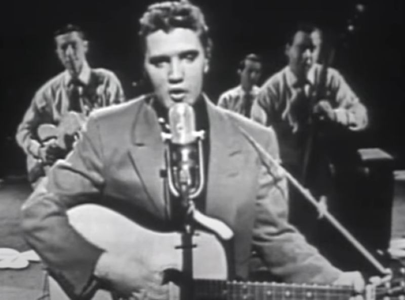 a young Elvis Presley with his backing band performing Heartbreak Hotel