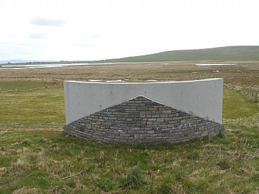 the curved stone and concrete listening wall
