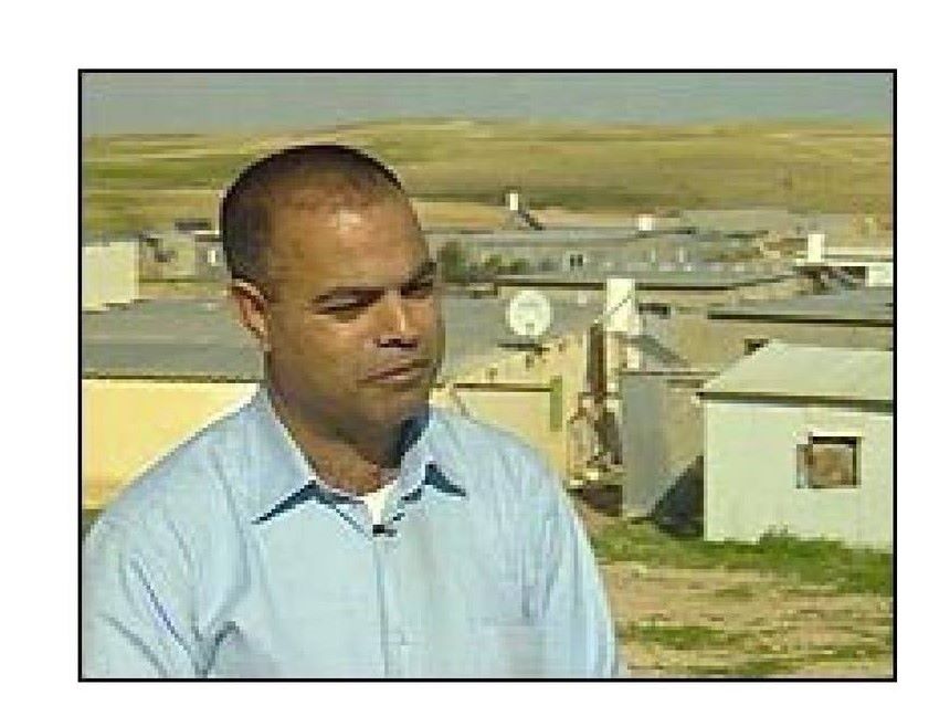 profile picture of Khalil Amour with his village in the background