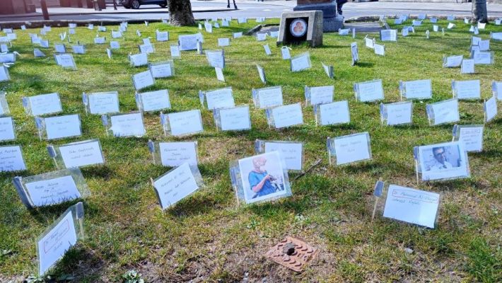 hundreds of names written on small flags of some of those who have died in Gaza on the Kirk green in Kirkwall