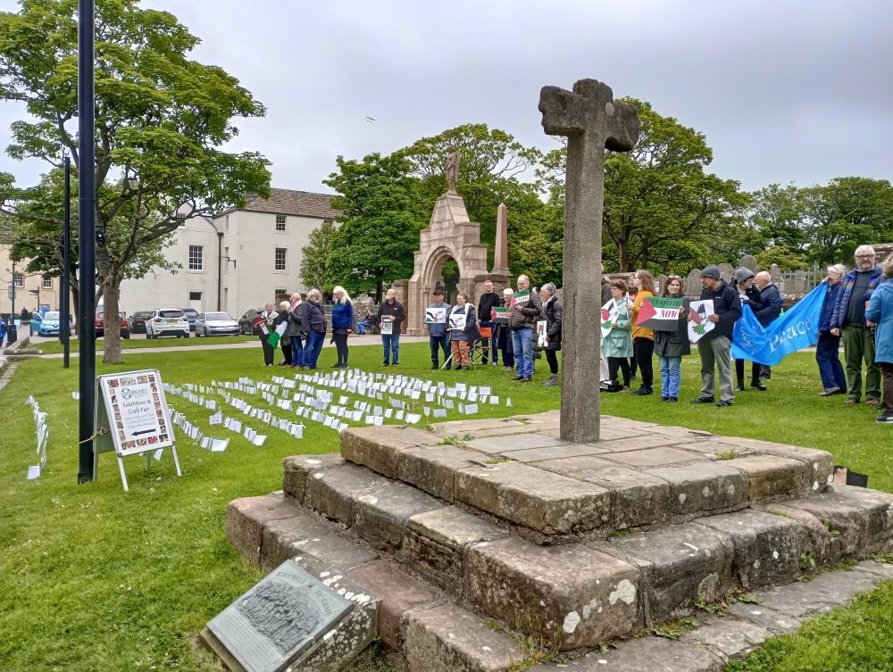 the mercat cross and the vigil with the names of some of the dead