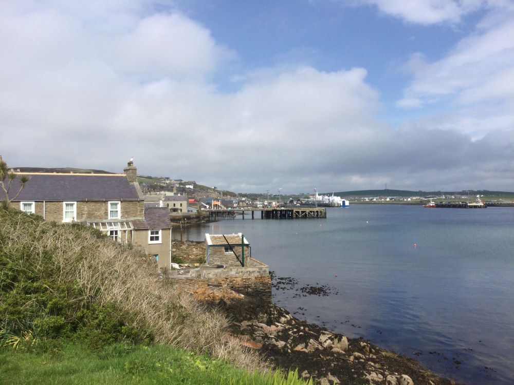 the south end of Stromness looking along the street and across the water toward the main centre of town