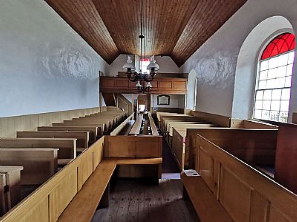 wooden benches oil lamps from ceiling