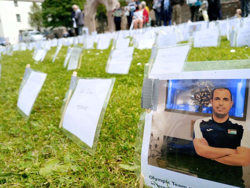 names and pictures of some of those killed in Gaza to the front is the Olympic Football Team Coach