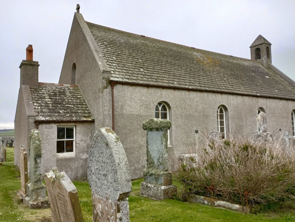 the outside of St Ninians Church and some gravestones