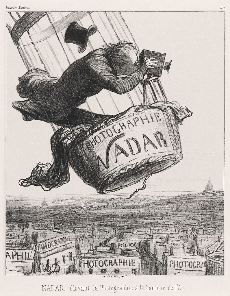 an illustration of Nadar hanging out of a balloon with a camera over the top of a city