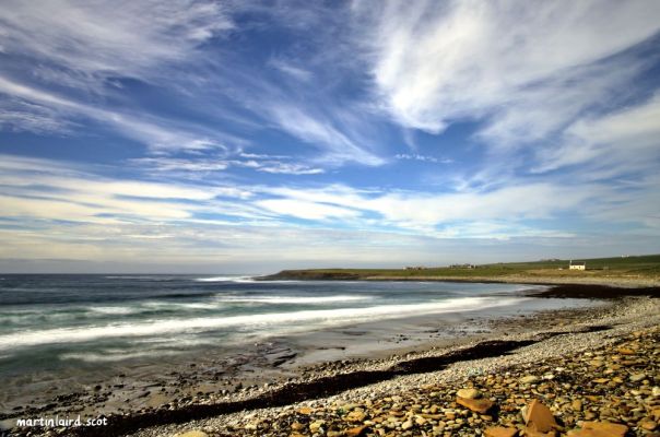 the wide expansive bay at Skaill with the pebbly shore line