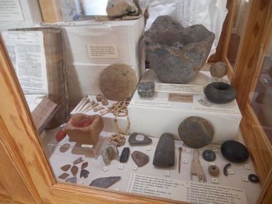 Neolithic stone objects in display case