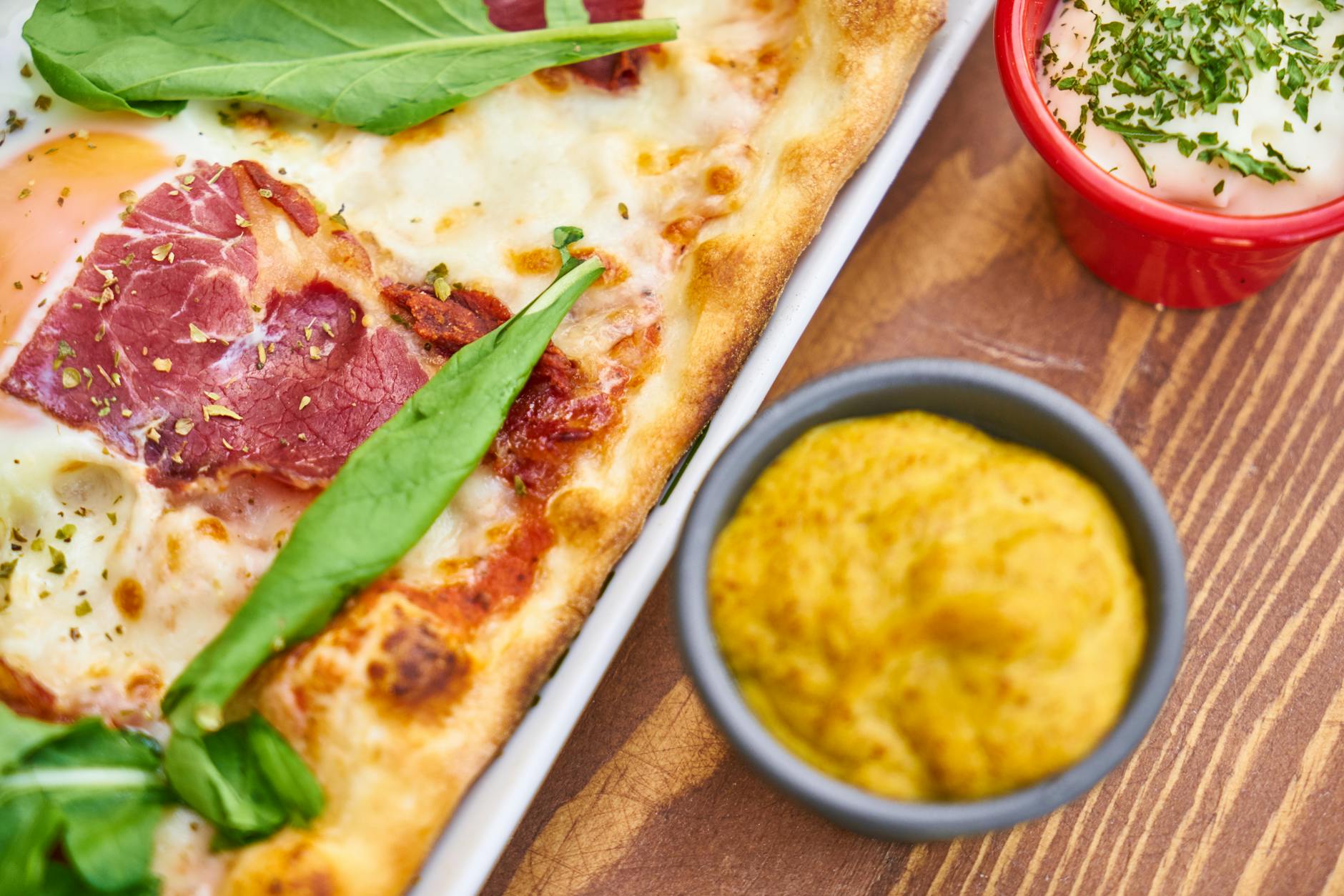 closeup photo of baked food with cream on white tray