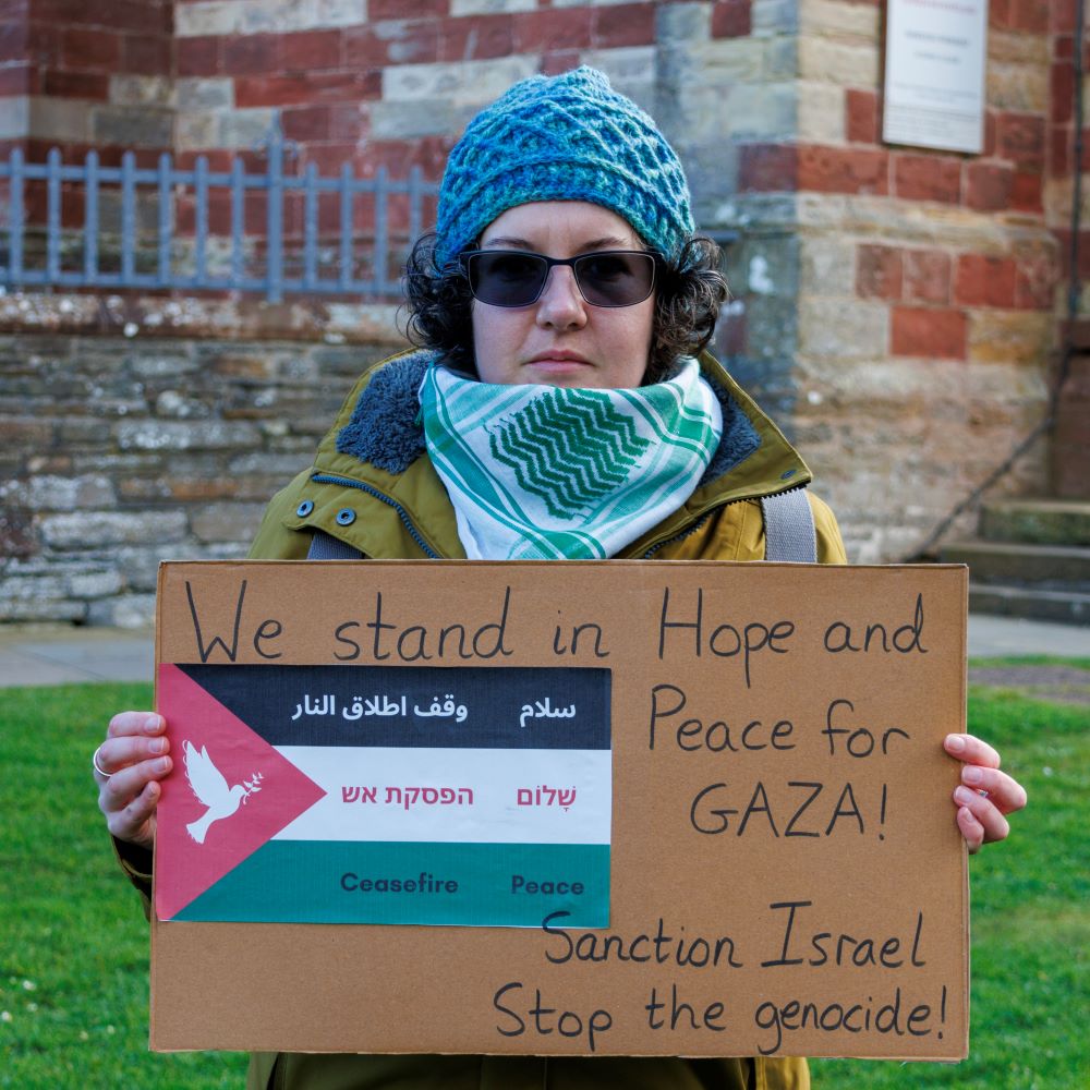 Woman holding poster