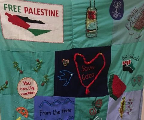 close up of some of the panels with Free Palestine and hearts