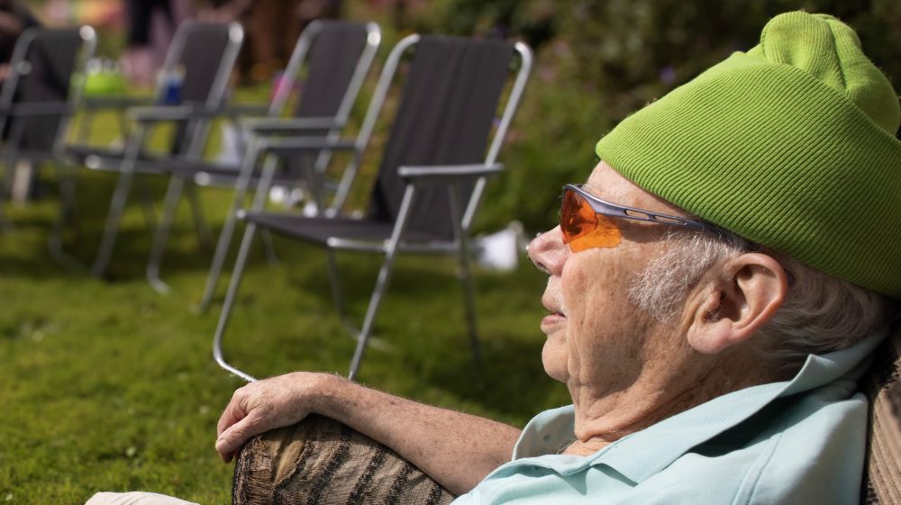 Edwin Heath sitting back in his garden