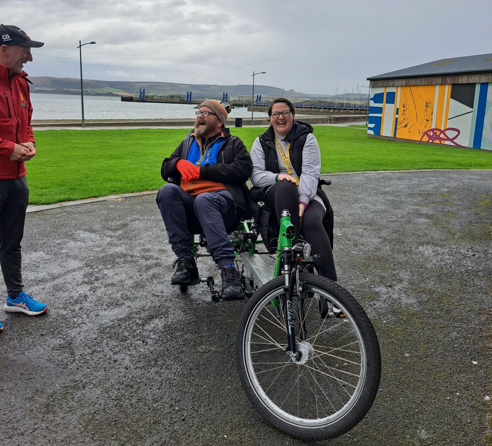 Lisa and Russell with the specially adapted cycle