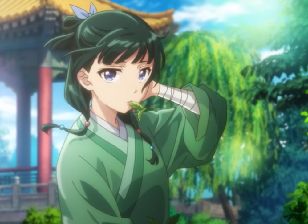 young woman in a setting of large foilage