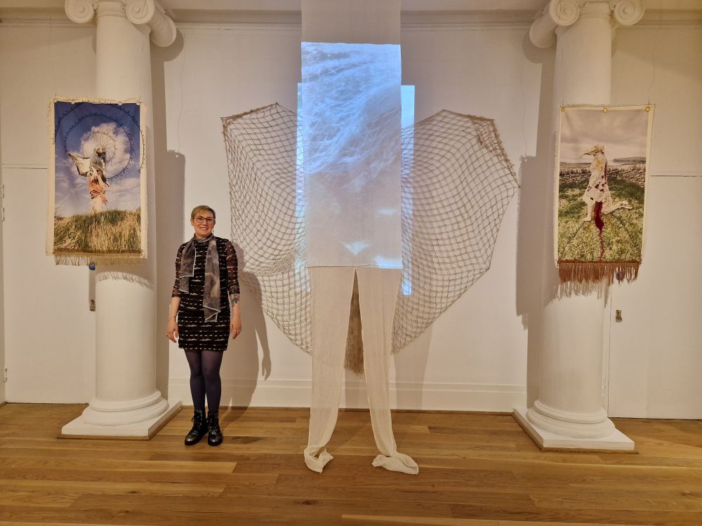 Anna Charlotta Gardiner with her installation Maan Emo, Ilman Emo, and Veden Emo, representing the ‘mothers’ of earth, air, and water, at the RSA . Photo by Caitlin Brodie.