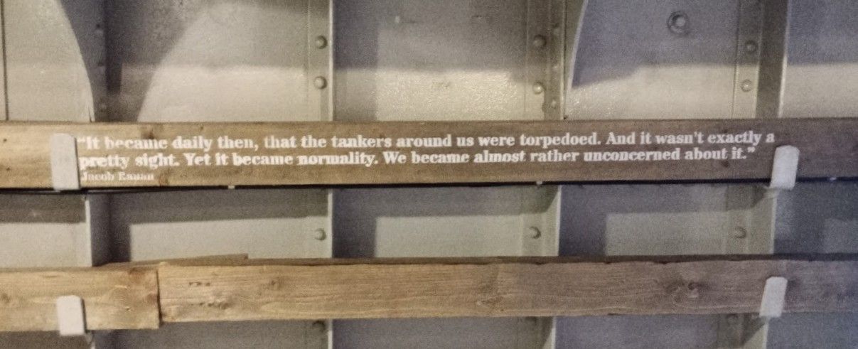 quote from a survivor on a wooden side panel