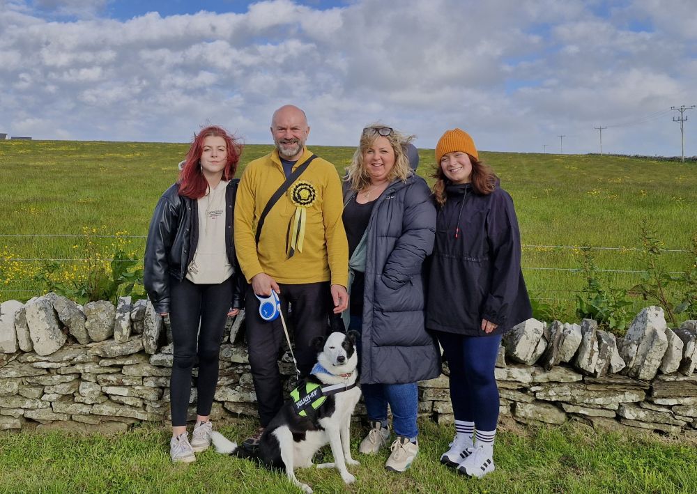 Robert Leslie, his wife two of his daughters and their collie dog