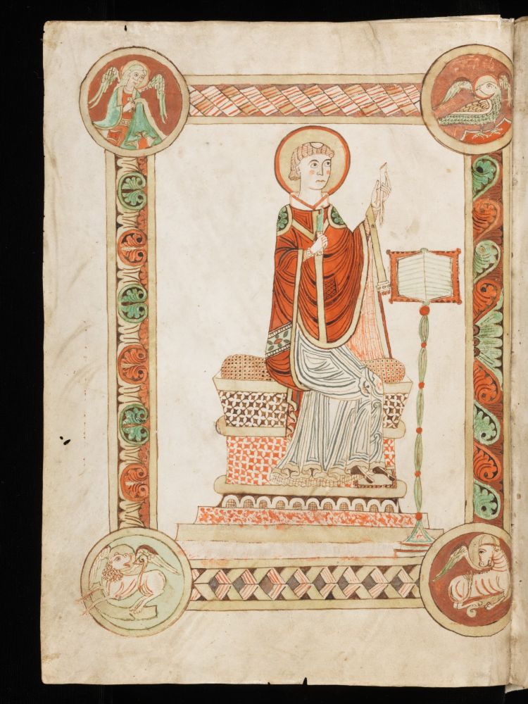 Bede sitting at his writing desk