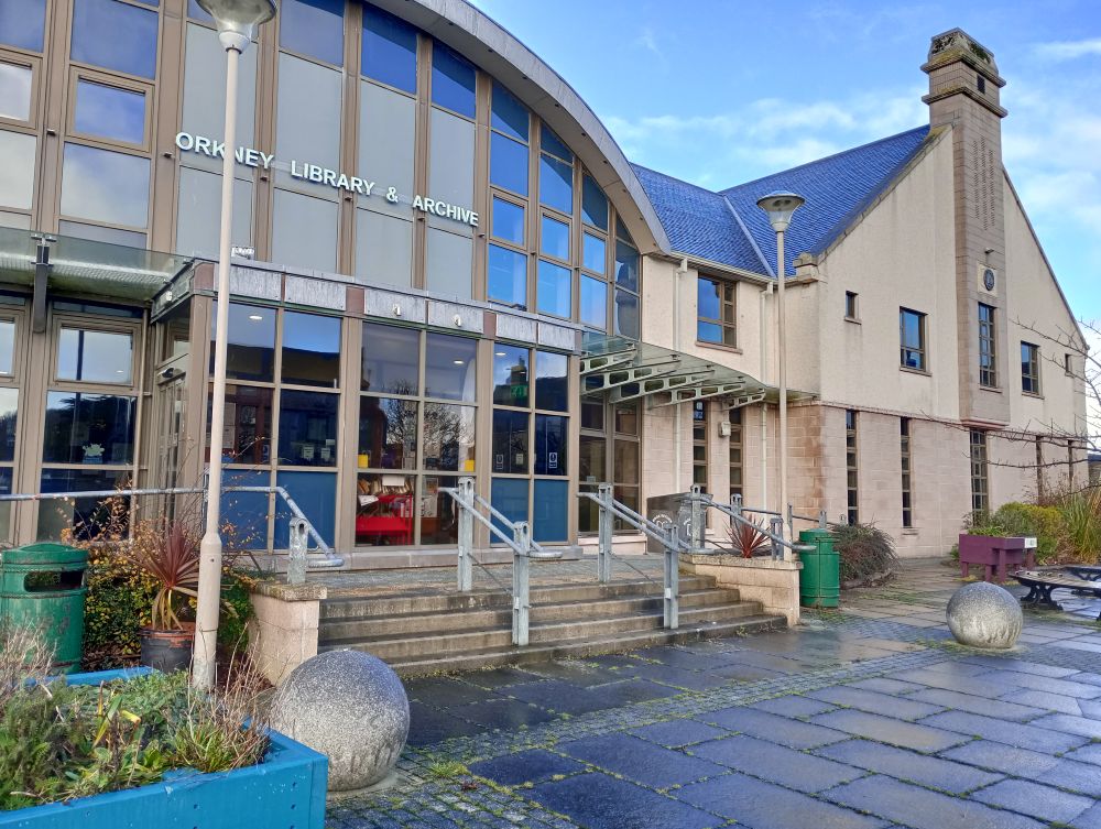 the outside of Orkney Library Kirkwall with some of the large concrete balls on its paved area