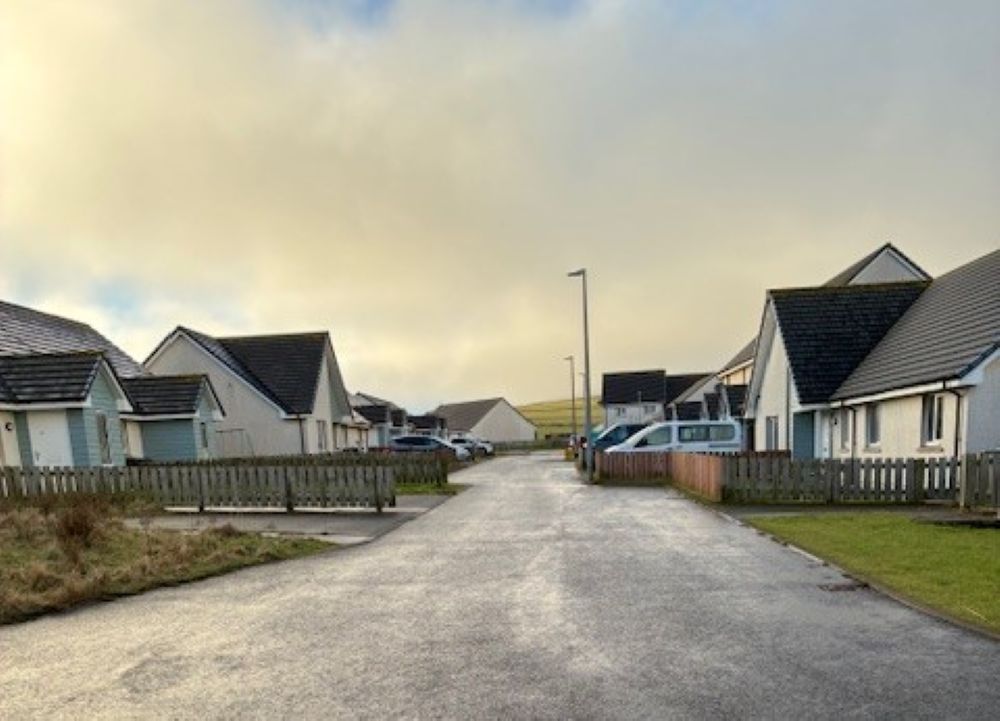 Liberators drive with houses each side of a road and no pavements