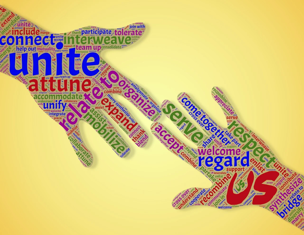to hands touching at a finger tip to unite